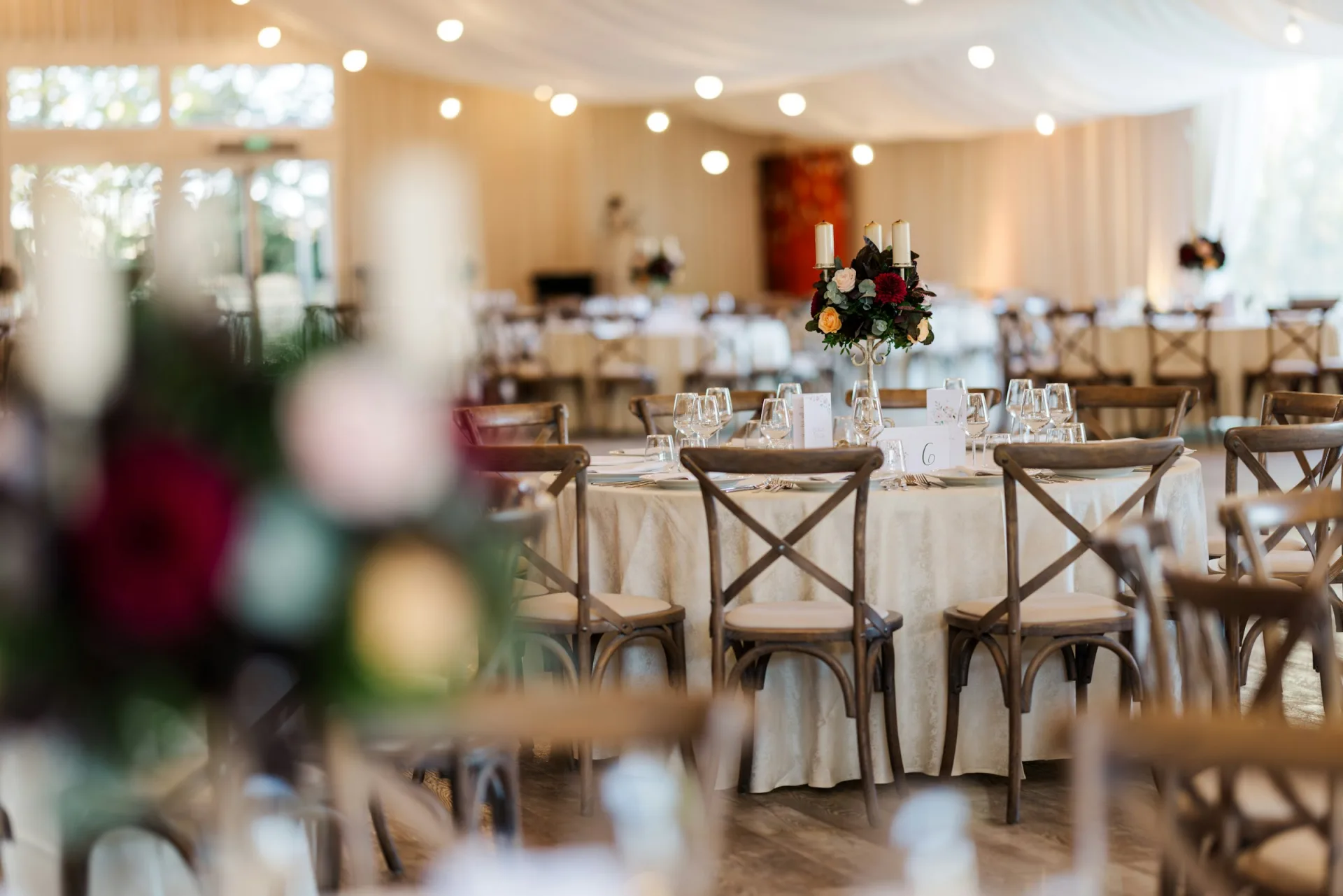 Elegant wedding reception prepared for guests in a softly lit venue